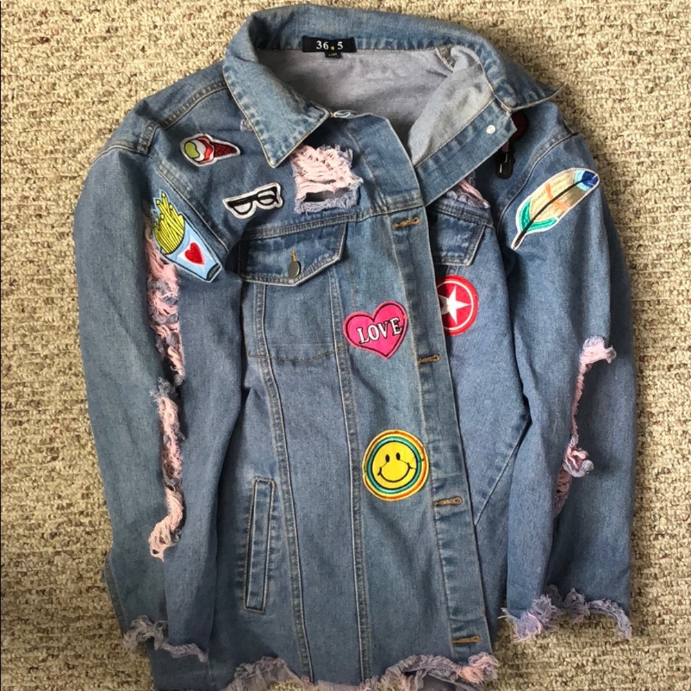 Distressed denim jacket with patches